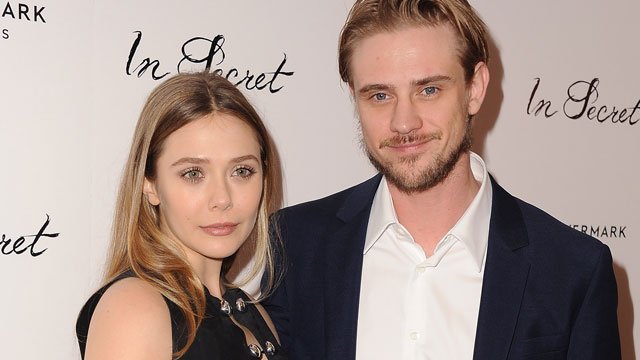 Elizabeth Olsen and Boyd Holbrook pose at the premiere of 'In Secret'