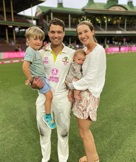 Alex Carey with his wife and kids.