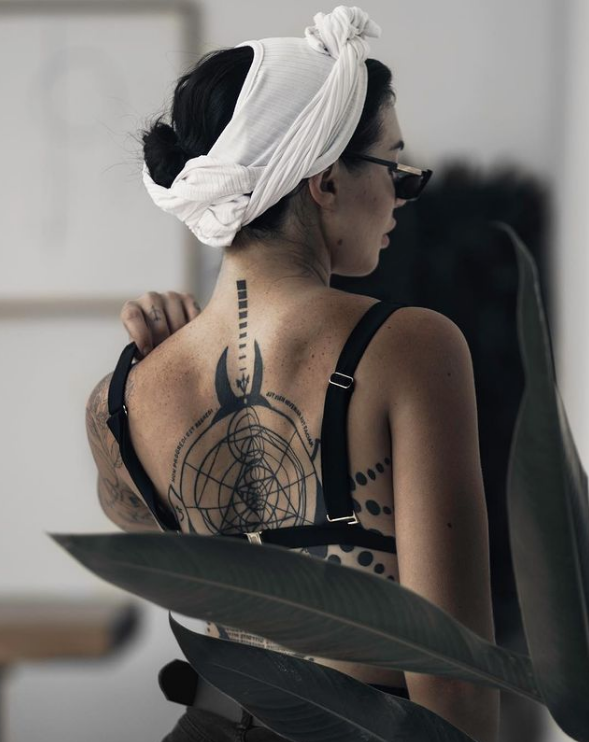 Rachel Aust showing off her back tattoo. 