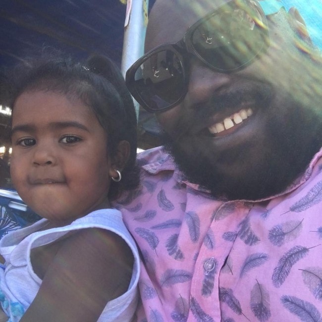 Faizon Love with his daughter.