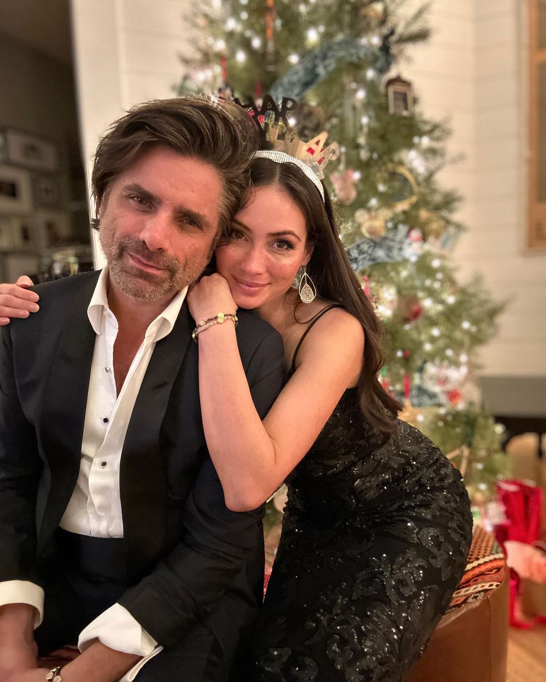 Caitlin McHugh wished her followers on Instagram A Happy New Year by sharing pictures with he husband John Stamos