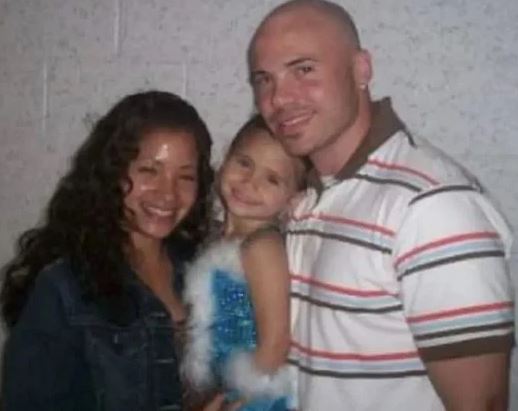 Nessa Barrett with her parents when she was young