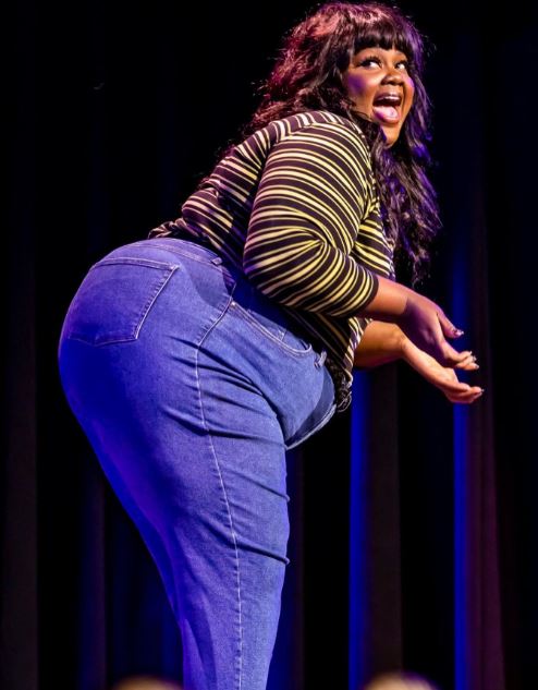 Nicole Byer performing stand-up comedy