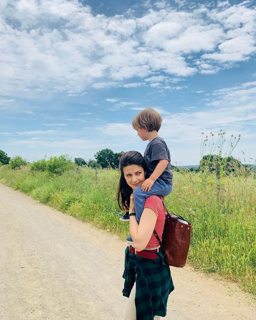 Barbara Ronchi carries her 3-year-old son Gio on her shoulder for a picture. 