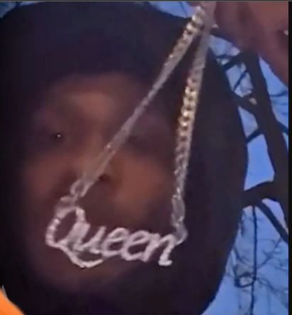 A TikToker showing off the chain he claimed to have stolen.