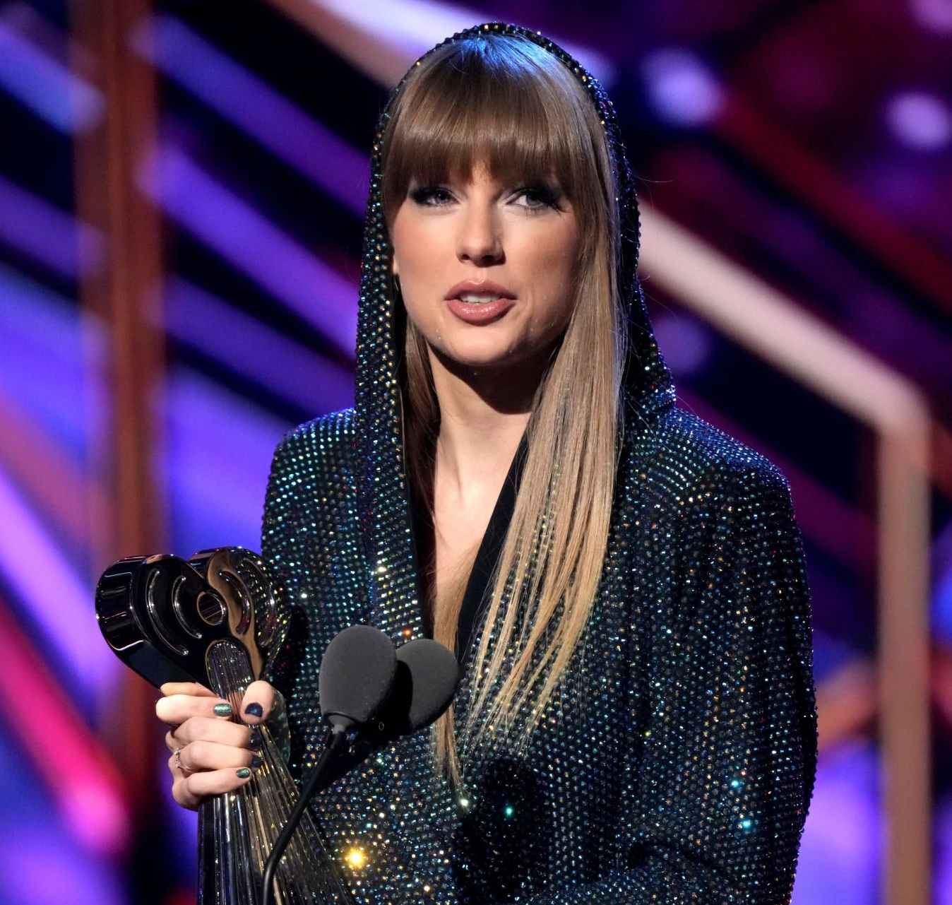 Taylor Swift accepts the iHeartRadio Innovator Award onstage.