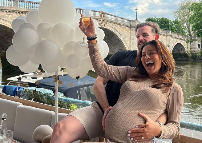 Montana Brown showing her belly with fiancee Mark O'Connor