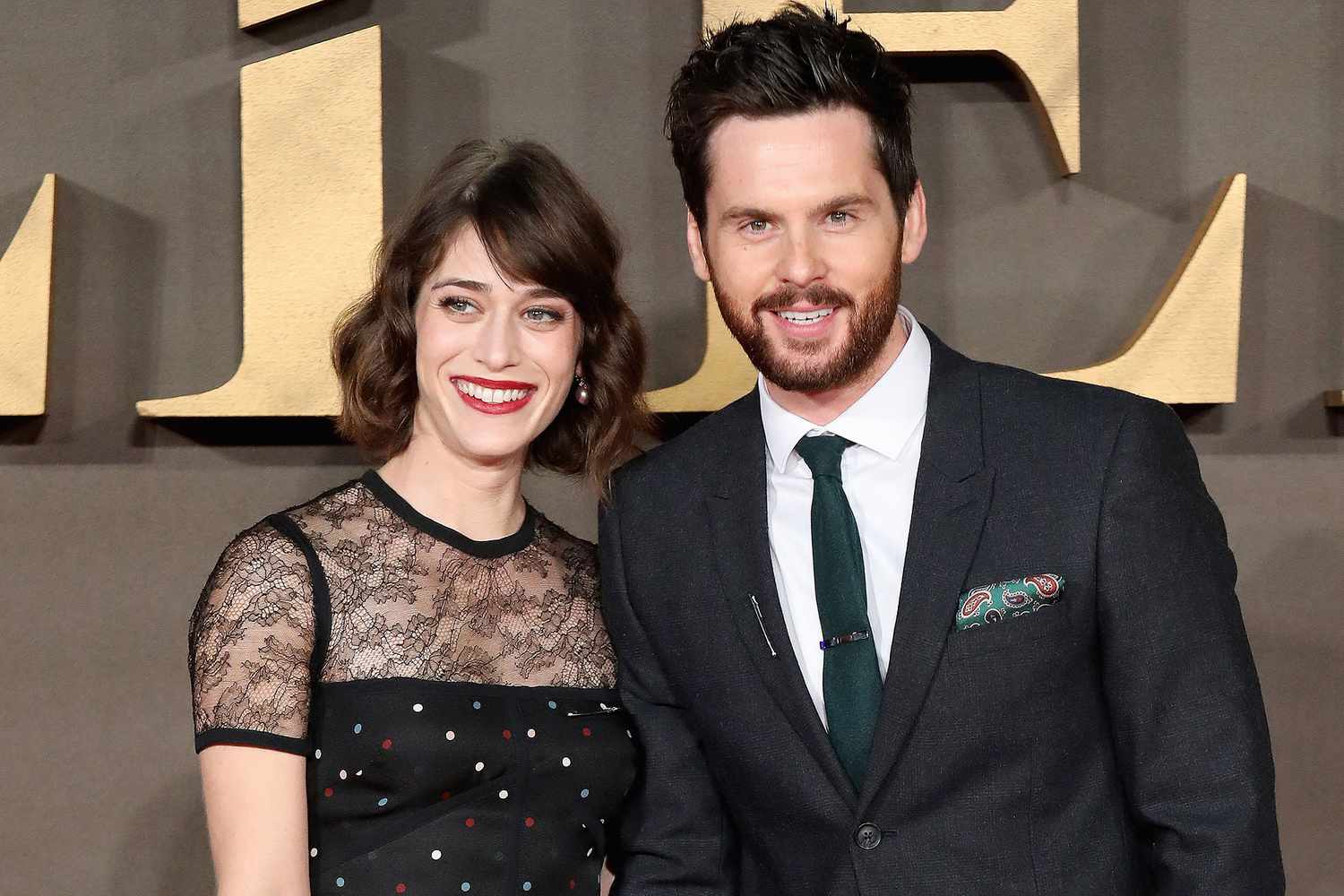 Lizzy Caplan and her husband.