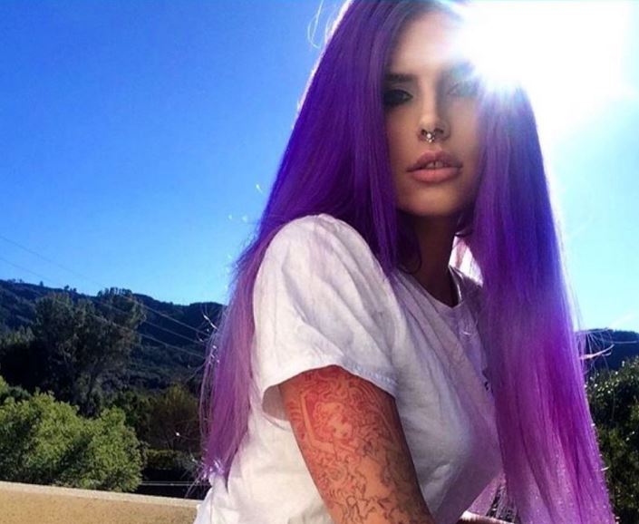 Cleo Rose Elliot in her punk rock era, flaunting her purple hair