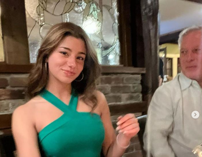 Mikayla Campinos with her father at her birthday dinner