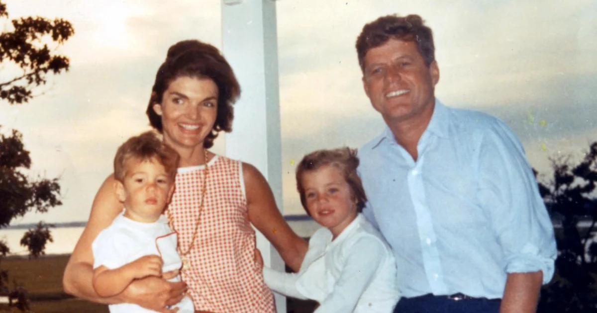 Jacqueline Kennedy Onassis with her two children and husband President John F. Kennedy.