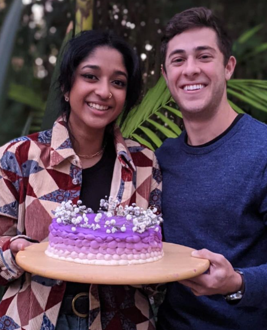 Maitreyi Ramakrishnan and rumored boyfriend Jaren Lewison holding cake a baked by Jaren 
