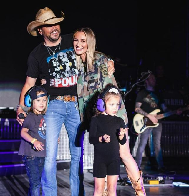 Jason Aldean with his wife Brittany Kerr and kids while on tour