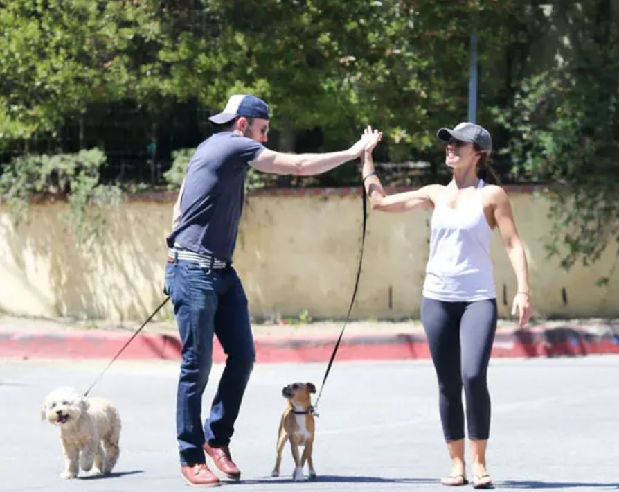 Minka Kelly and Chris Evans walking their dog together