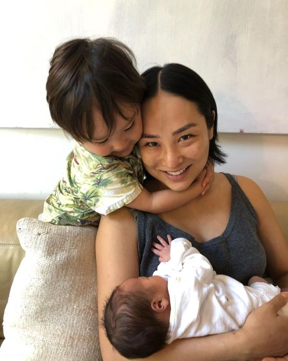 Greta Lee with both of her children