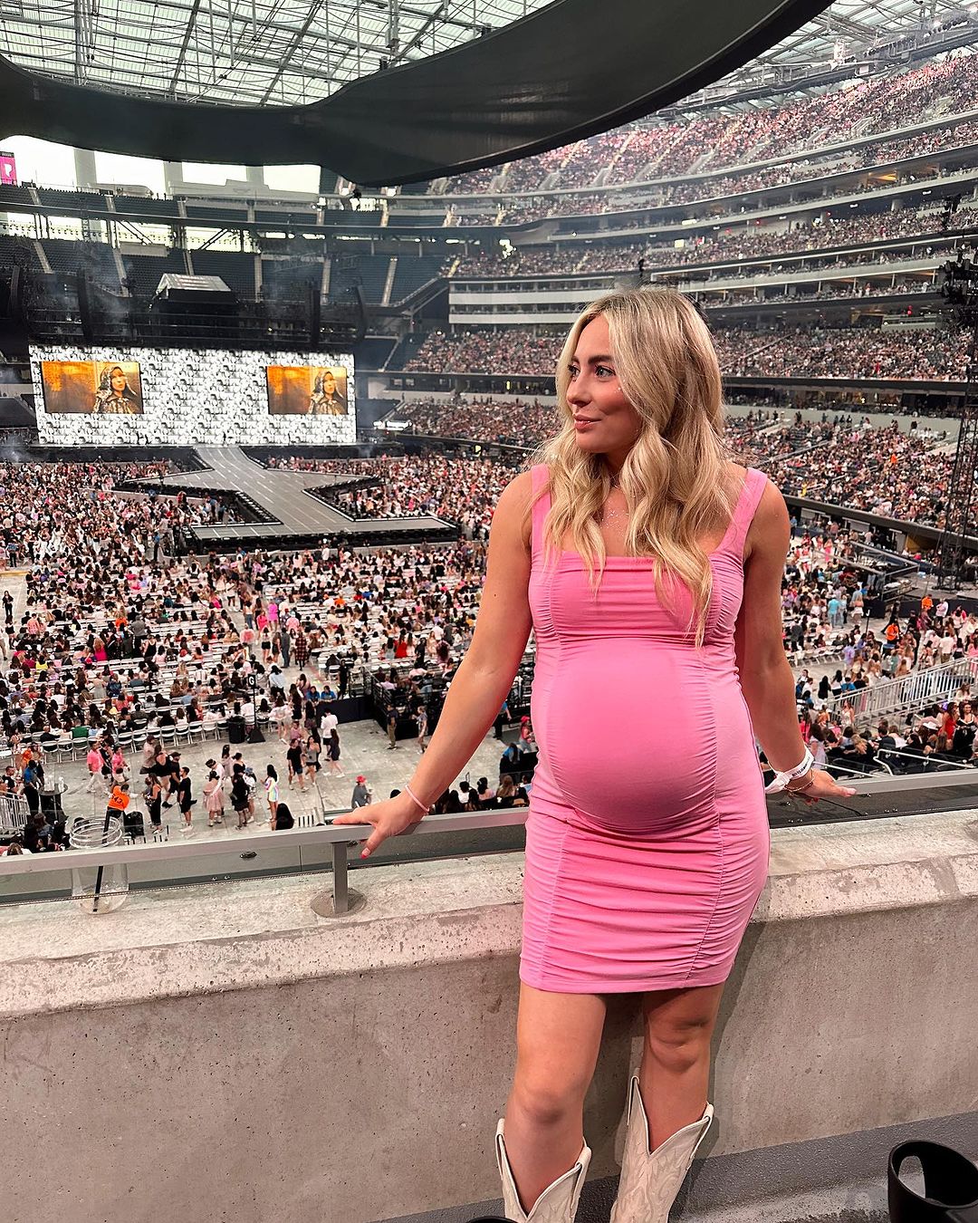 MyKayla Skinner proudly showcases her baby bump at Taylor Swift's The Eras Tour. 