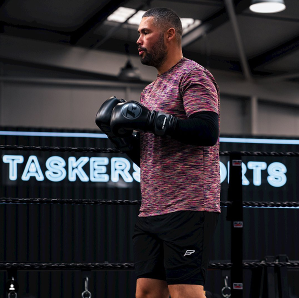 Tony Bellew posing for frequency fitness